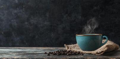 Coffee cup with steam and coffee beans on a wooden background. A cup of hot espresso or black latte, with a burlap sack on an old, rustic table photo