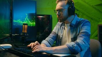 Exhausted Caucasian guy crypto trader broker man working overtime late night tiredness. Male worker yawn trading stock deadline at home neon freelancer typing computer software overwork programming photo