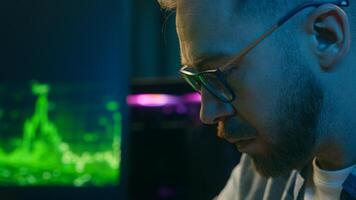 Concentrate Caucasian man trader businessman addict typing keyboard pc computer at home neon agent freelancer working crypto stock male broker writing worker guy developer planning business at night photo