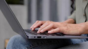Closeup female hands unrecognizable businesswoman professional user worker writer freelancer using computer app typing laptop notebook keyboard outdoors in city outside working online with pc software photo