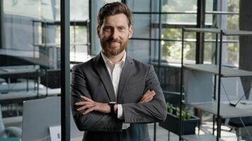 Caucasian 40s middle-aged adult bearded successful boss investor entrepreneur employer business man leader lawyer in office posing confident strong pose position with crossed folded hands arms smiling photo