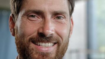 Front view close up male portrait indoors serious pensive dreaming planning man looking away thinking turn head to camera smiling toothy dental happy good idea reaction businessman look with smile photo
