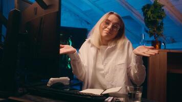 Caucasian business woman girl female crypto currency trading computer late night work overwork programmer hacker investor yawn sleep study deadline typing code insomnia sleeping tired shrug shoulders photo