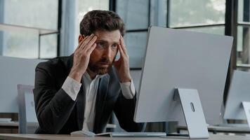 Caucasian bearded 40s middle-aged businessman worker employee man typing laptop feel failure upset with lost of information online error stressed look at computer screen suffer from headache pressure photo