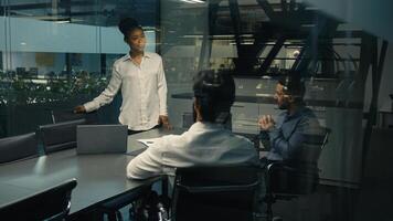 African American businesswoman leader woman female coach business trainer CEO leader boss talking to multiracial business team multiethnic diverse group of workers in office brainstorming teamwork photo