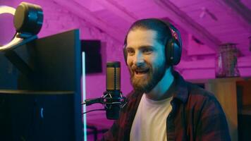 Shocked Caucasian man angry vlogger talking microphone mic addicted influencer scream furious blogger guy streaming losing game blog shout rage home e-sport vlog emotional male gamer gesturing photo