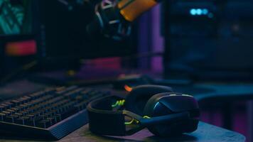 Addict Caucasian man guy streamer vlogger putting on headphones male gamer blogger prepare for stream radio broadcast influencer player talking communicate microphone mic at home play online game vlog photo