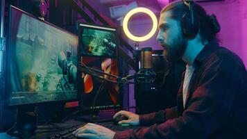 Caucasian gamer man addict puzzled influencer streaming play videogame blog computer screen surprise confused male guy blogger removing headphones shock scam losing game cheat e-sport problem at home photo