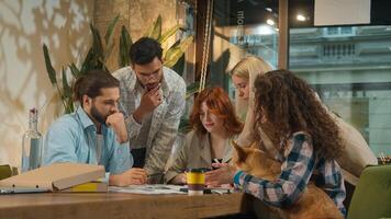 Multiethnic group creative pet dog friendly office coworking diverse team designers colleagues freelance coworkers business men women happy girls guys students friends talk study project drink coffee photo