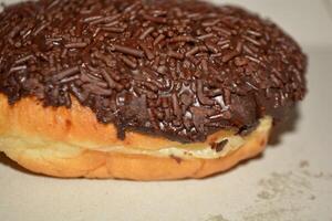 Delicious close up of cake with chocolate donut or bread with tasty look photo