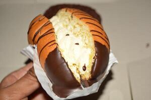 Delicious close up of cake with chocolate donut or bread with tasty look photo