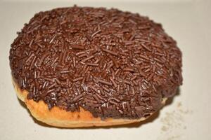 Delicious close up of cake with chocolate donut or bread with tasty look photo