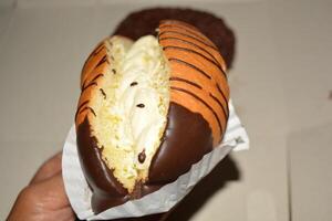 Delicious close up of cake with chocolate donut or bread with tasty look photo