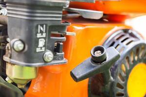 Manual starter handle for starting a walk-behind tractor, close-up photo