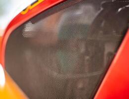 Protective net engine compartment in the car, an element of tuning. Background, copy space, mesh photo