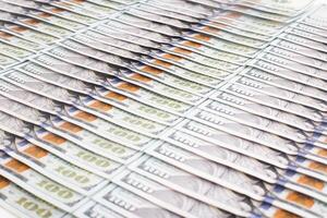 Background from American banknotes of 100 dollars. Business and economics concept, copy space for text, financial photo