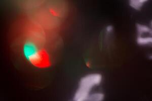 Blurred lens flare. Defocused colorful lights. Shiny glowing spots, abstract background and texture photo