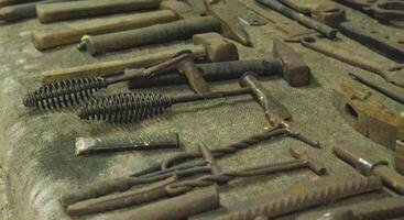 Lots of metal tools to work in the forge. Background, industry. photo