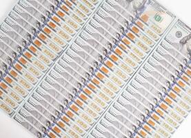 Lots of 100 us dollar banknotes, background. Business and currency exchange concept, copy space for text photo