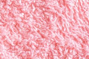 Texture background fabric with pile. Pink soft cloth, macro photo