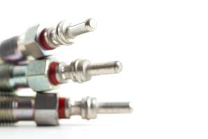 Modern ceramic glow plugs for warming up a diesel engine before starting. White background, isolate. Macro photo