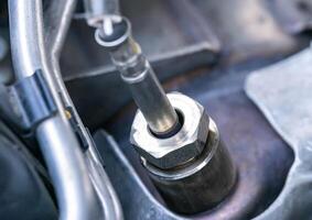Automotive sensor lambda probe in a diesel engine. Measuring oxygen content in car exhaust gases, macro photo