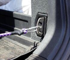 latch in the trunk of the car for securing goods and objects, close-up photo