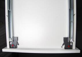 Kitchen drawer with full extension flush-mounted slides with Push to open system, close-up photo