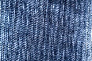 Blue denim, background. Stylish jeans, macro, design photo