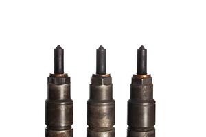 Needles and nozzles on nozzles from a diesel engine. Deterioration of the fuel system of the car, macro. White background, isolate photo