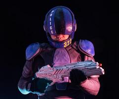 Cyberpunk future concept. Police officer reloads futuristic shotgun in dark. Robot aims at camera. Halfman bionic cyborg releases disconnector assembly of gun. Science fiction scene, fantasy, sci photo
