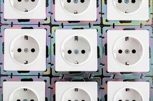 Background from home electric sockets, close-up. The concept of tariffs and prices for electricity photo