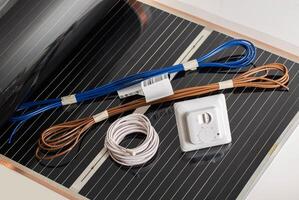 Set for mounting infrared floor heating. Wires, temperature sensor and thermostat. Comfortable, temperature photo