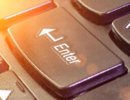 Button enter on the keyboard, macro, fingerboard photo
