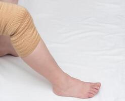Orthopedic kneecap to relieve the load and fix the sore knee, close-up, copy space, medical, bandage photo