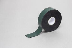 Reel of double-sided tape on a silver background, close-up, scotch tape, scotch photo