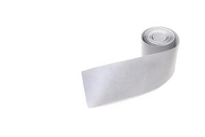 A roll of reflective tape on a white background, close-up, isolate, visibility, light reflection tape, equipment photo