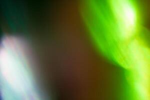 illuminated burst of multicolor light. lens flare shine effects. creative background, abstract photo