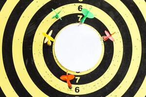 A target with darts in the center of which an empty inscription space photo