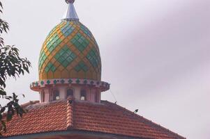 view of the mosque dome with a white sky background photo