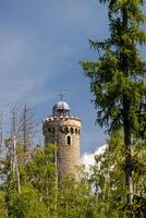 A tower with a clock on top of it photo