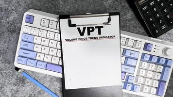 Concept of VPT - Volume Price Trend Indicator write on paperwork isolated on Wooden Table. photo