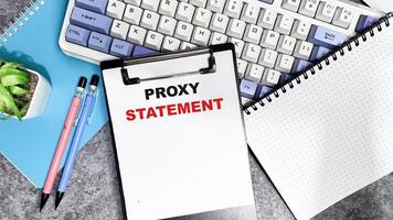 Concept of Proxy Statement write on paperwork isolated on Wooden Table. photo