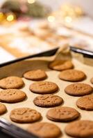a tray of cookies on a table, Oven tray with fresh hot gingerbread cookies photo