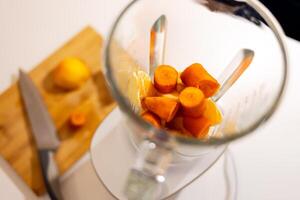 a blender with a bunch of carrots in it photo