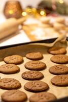a baking sheet with gingerbread cookies on it photo