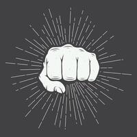 A fist with a ray burst on it vector