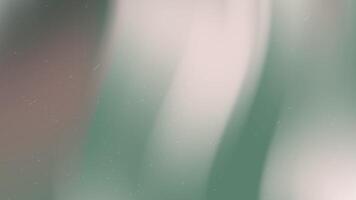 Soft green and beige blurred background with specks, ideal for naturethemed designs, abstract concepts, or calming wallpaper for websites. video
