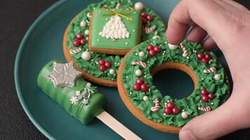 Natural popsicle ice cream on a stick covered with chocolate in the style and colors of Christmas and New Year on a dark concrete background video