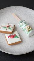 Natural popsicle ice cream on a stick covered with chocolate in the style and colors of Christmas and New Year on a dark concrete background video